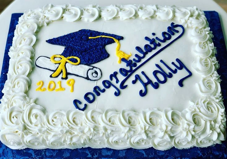 A simple sheet cake with blue and white frosting for a graduate